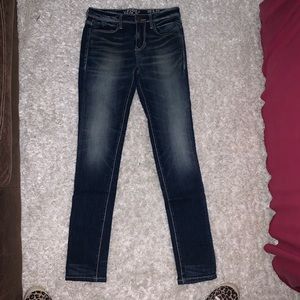 Buckle black skinny jeans